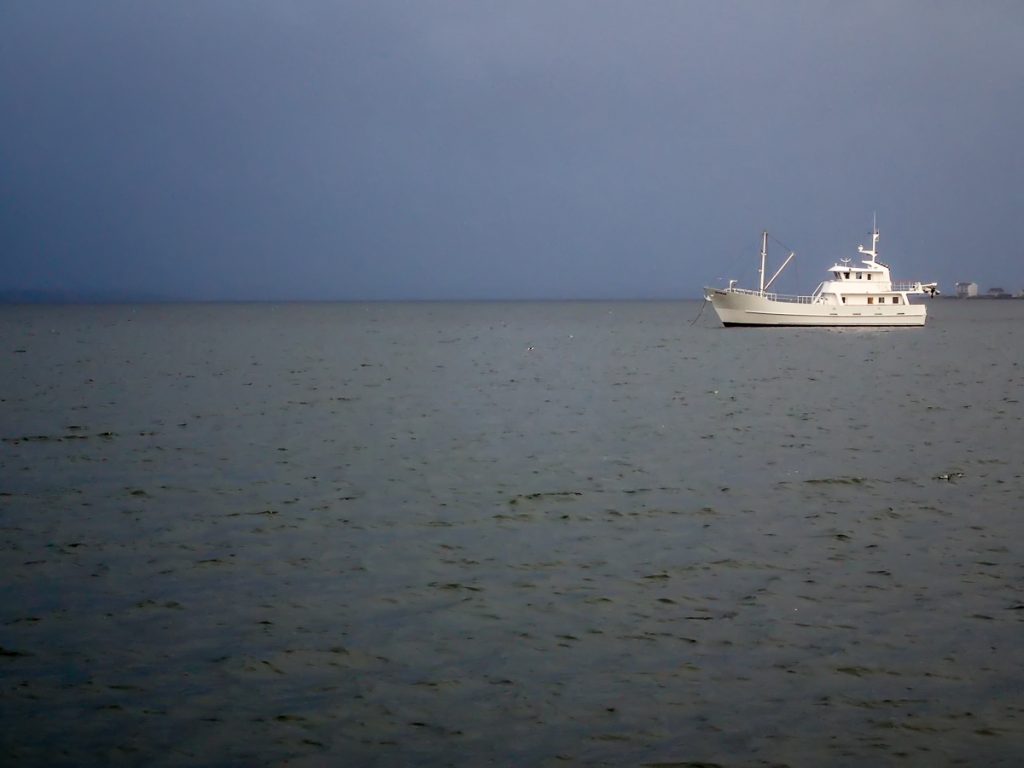 Large trawler and ominous sky